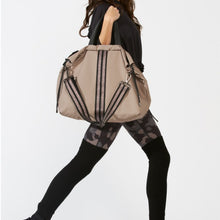Load image into Gallery viewer, Woman carrying a ACE Tote Bag color Taupe made with ECONYL® regenerated nylon
