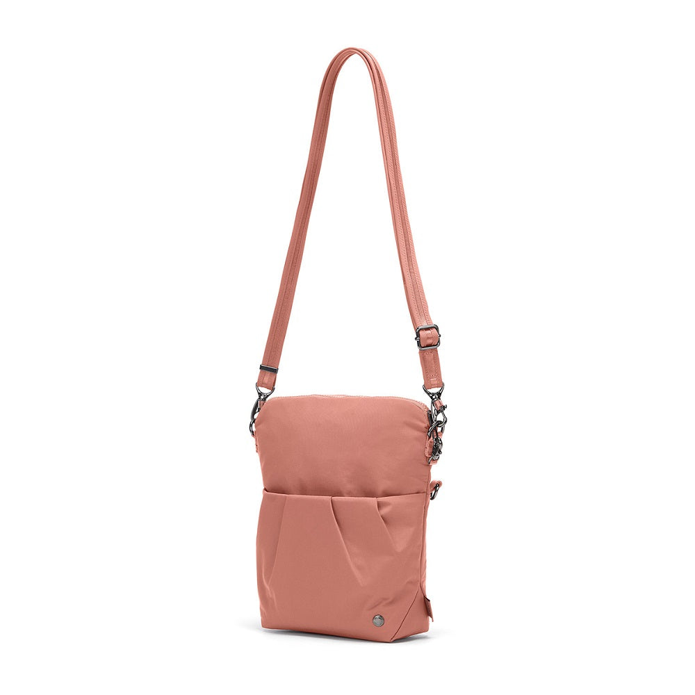 Side view of the Pacsafe Citysafe CX Anti-Theft Convertible Crossbody color Rose made with ECONYL® regenerated nylon extended