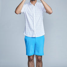 Load image into Gallery viewer, Man wearing The Triton Short Pant State Of Matter color Aqua made with ECONYL® regenerated nylon
