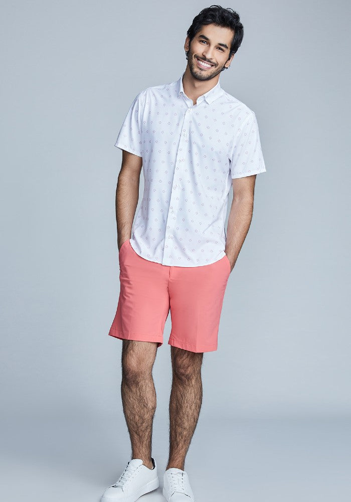 Man wearing The Triton Short Pant State Of Matter color Canyon Rose made with ECONYL® regenerated nylon