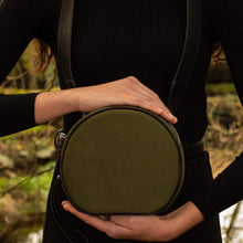 Load image into Gallery viewer, Woman carrying The Gallery Messenger bag aoife® color Military green made with ECONYL® regenerated nylon
