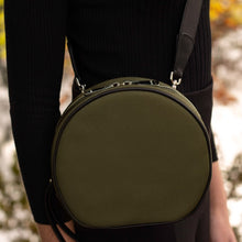 Load image into Gallery viewer, Side view of The Gallery Messenger bag aoife® color Military green made with ECONYL® regenerated nylon
