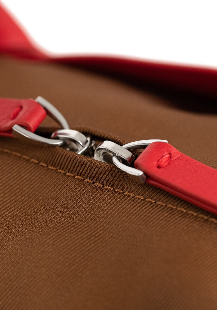 Detail of The Gallery Duffel Bag aoife® color Brown and Red made with ECONYL® regenerated nylon