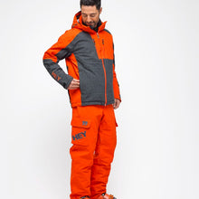 Load image into Gallery viewer, Man wearing the Alyeska-Ecoball Pants Hey Sport color Orange made with ECONYL® regenerated nylon
