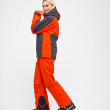 Load image into Gallery viewer, Side view of the Crested Pants Hey Sport color Orange made with ECONYL® regenerated nylon
