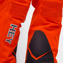 Load image into Gallery viewer, Detail of the Crested Pants Hey Sport color Orange made with ECONYL® regenerated nylon
