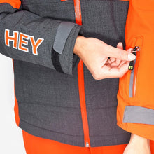 Load image into Gallery viewer, Pocket detail of the Snowbird Wool Jacket Woman Hey Sport color Grey and Orange made with ECONYL® regenerated nylon
