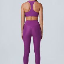 Load image into Gallery viewer, Back view of a woman wearing the Mila Leggings Plum by Outfyt color Purple made with ECONYL® regenerated nylon

