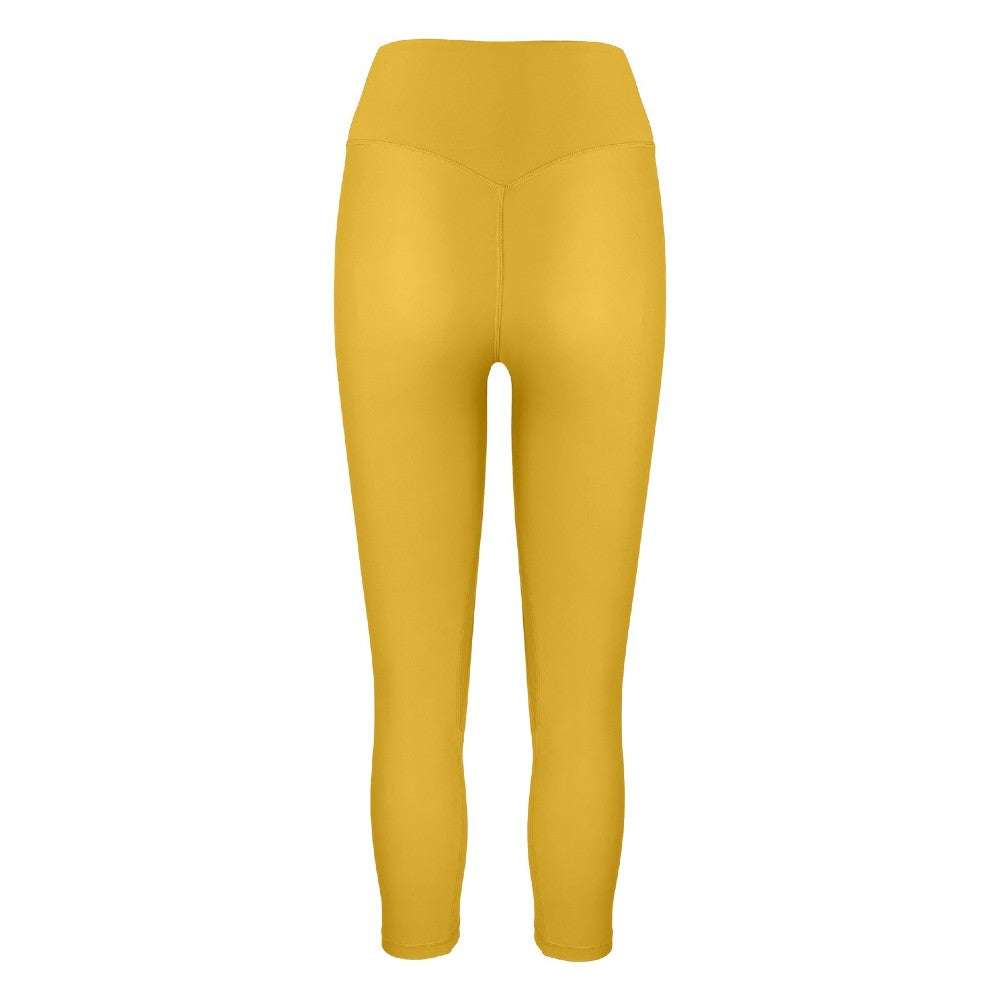 Back view of the Mila Leggings Mustard by Outfyt color Yellow made with ECONYL® regenerated nylon