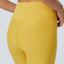 Load image into Gallery viewer, Detail of the Mila Leggings Mustard by Outfyt color Yellow made with ECONYL® regenerated nylon
