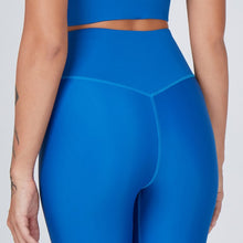 Load image into Gallery viewer, Detail of the Sage Leggings Aegean by Outfyt color Blue made with ECONYL® regenerated nylon
