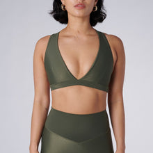 Load image into Gallery viewer, Front view of a woman wearing the Lilly V 2.0 Olive by Outfyt color Green made with ECONYL® regenerated nylon
