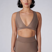 Load image into Gallery viewer, Front view of a woman wearing the Lilly V 2.0 Sand by Outfyt color Beige made with ECONYL® regenerated nylon

