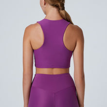 Load image into Gallery viewer, Back view of a woman wearing the Tula Crop Top Plum by Outfyt color Purple made with ECONYL® regenerated nylon
