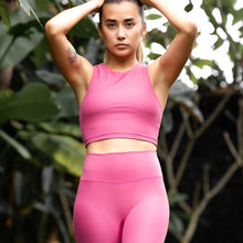 Load image into Gallery viewer, Woman wearing the Tula Crop Top Rose by Outfyt color Pink made with ECONYL® regenerated nylon

