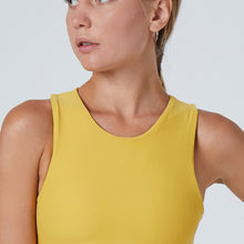 Load image into Gallery viewer, Detail of the Tula Crop Top Mustard by Outfyt color Yellow made with ECONYL® regenerated nylon
