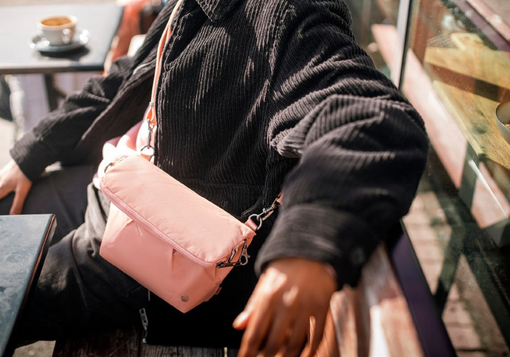 Everyday with the Pacsafe Citysafe CX Anti-Theft Convertible Crossbody color Rose made with ECONYL® regenerated nylon