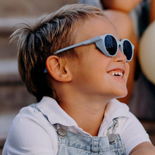 Load image into Gallery viewer, Young boy wearing SooNice Children Sunnies by SooNice color ice blue made with ECONYL® regenerated nylon
