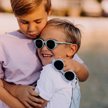 Load image into Gallery viewer, Young boys wearing SooNice Children Sunnies by SooNice color mint green made with ECONYL® regenerated nylon
