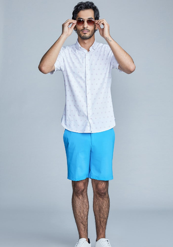 Man wearing The Triton Short Pant State Of Matter color Aqua made with ECONYL® regenerated nylon